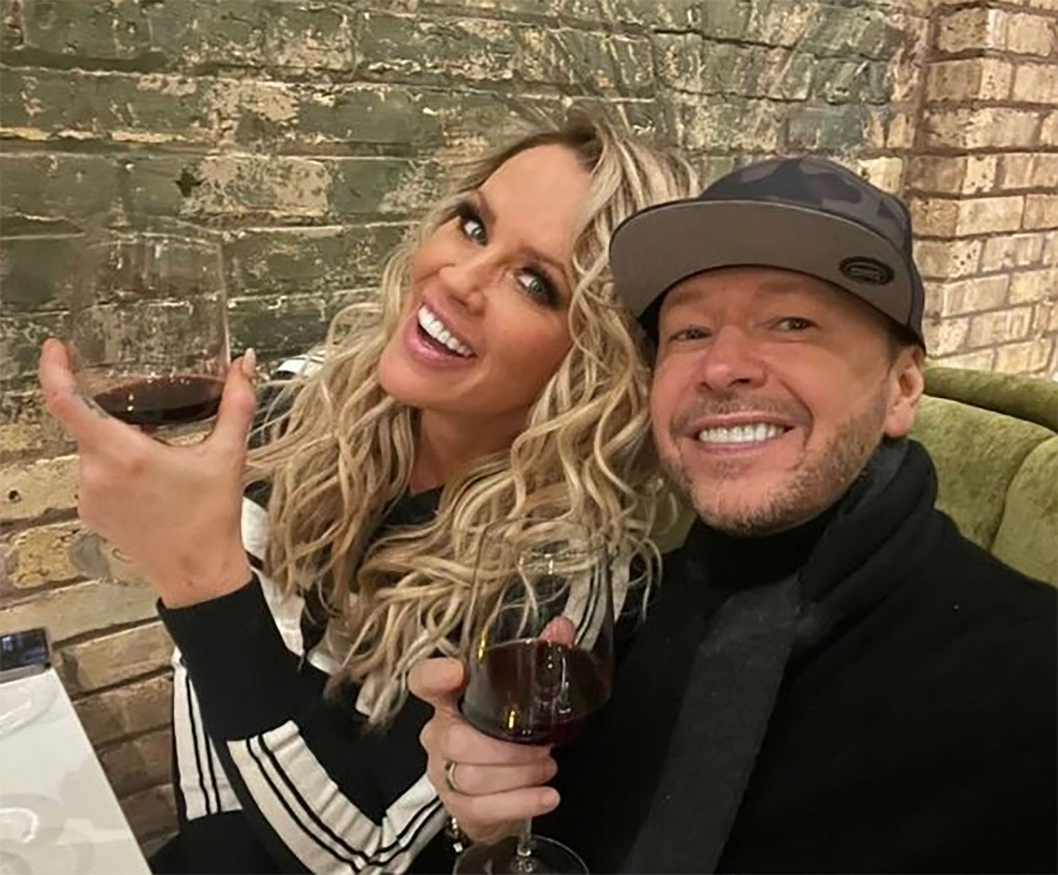 Jenny McCarthy and Donnie Wahlberg pop into Scott Harris Hospitality's newest concept and St. Charles hotspot, Mio Modo, after the annual holiday parade.